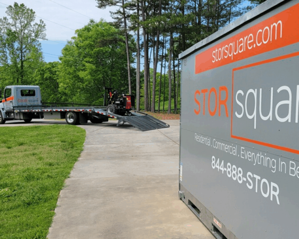 A storage container sitting near the driveway while the STORsquare truck prepares for pickup.