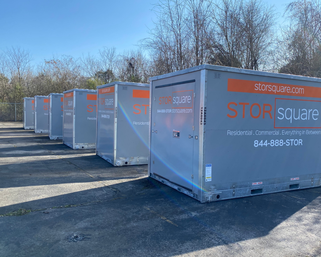 STORsquare portable storage containers lined up and ready for moving and storage rentals in Acworth, Georgia.