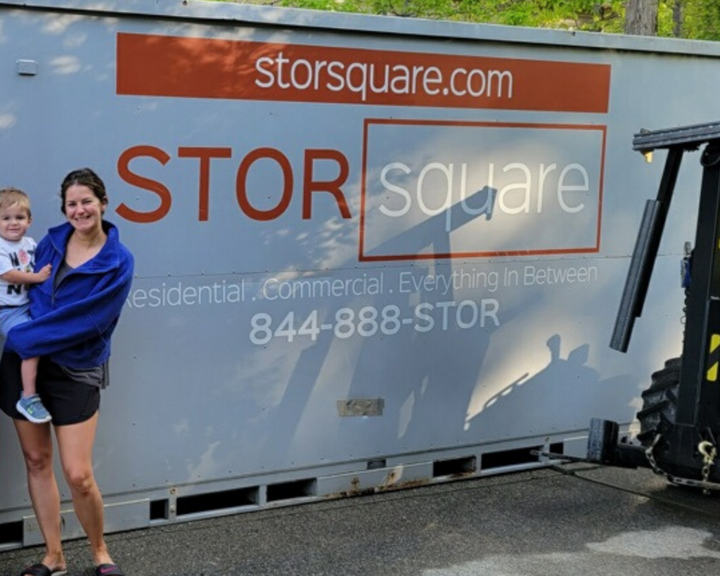 Mother and child next to a STORsquare portable storage container used for moving and storage in Acworth, GA.