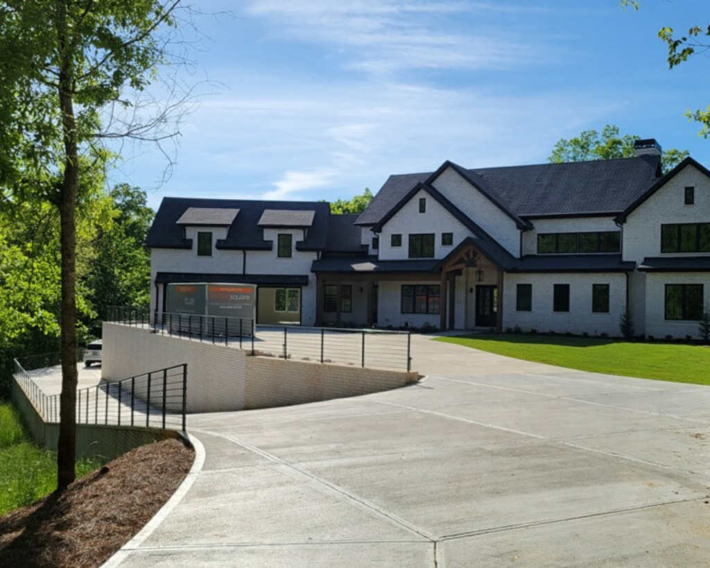 STORsquare portable storage container placed at a modern residential property with a sloped driveway in Marietta, Georgia.