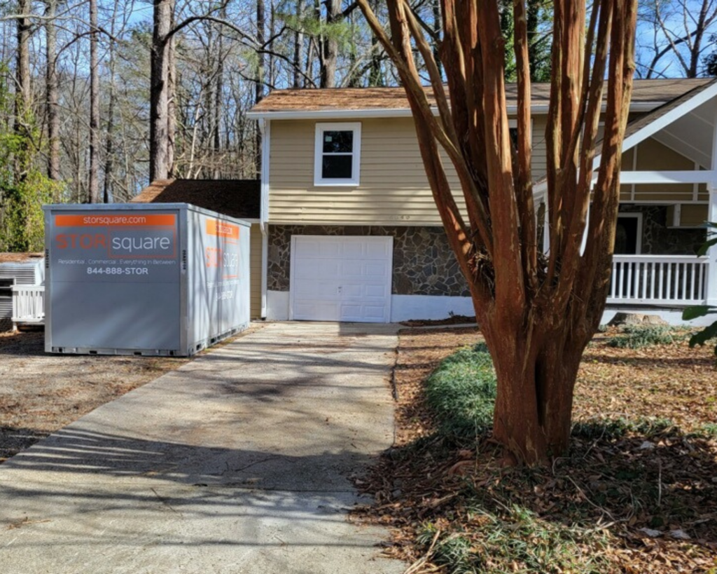 STORsquare portable storage container placed beside a residential driveway in Woodstock Georgia