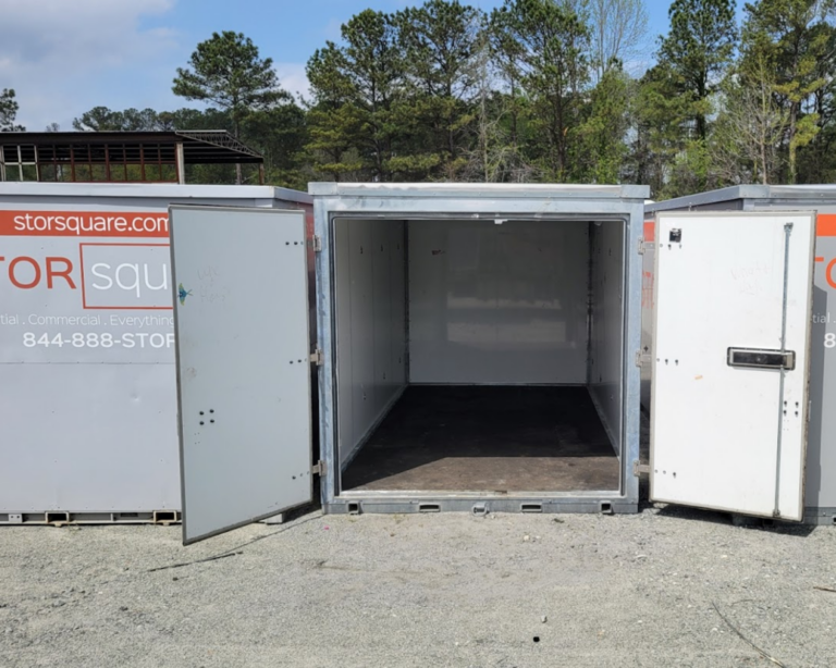Open STORsquare portable storage container showing empty interior inside an outdoor storage yard in Woodstock Georgia