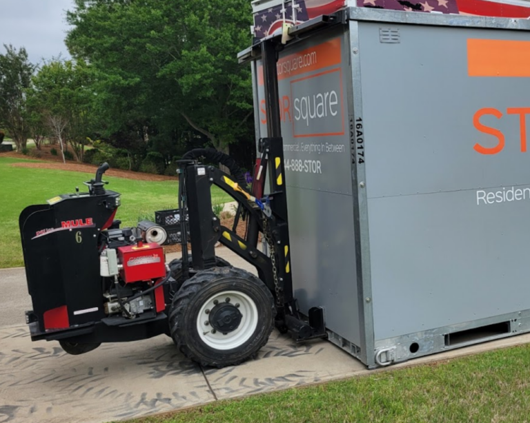 STORsquare portable storage container being positioned on a driveway using a no-tilt Mule delivery system in Woodstock Georgia