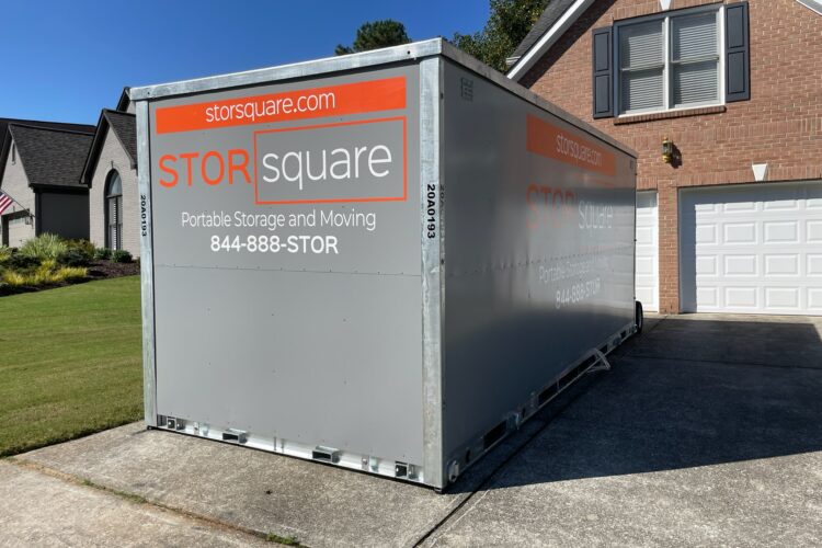 A portable storage container parked in a Maryville, Tennessee driveway, a common moving setup while using the perfect moving day playlist to stay energized.