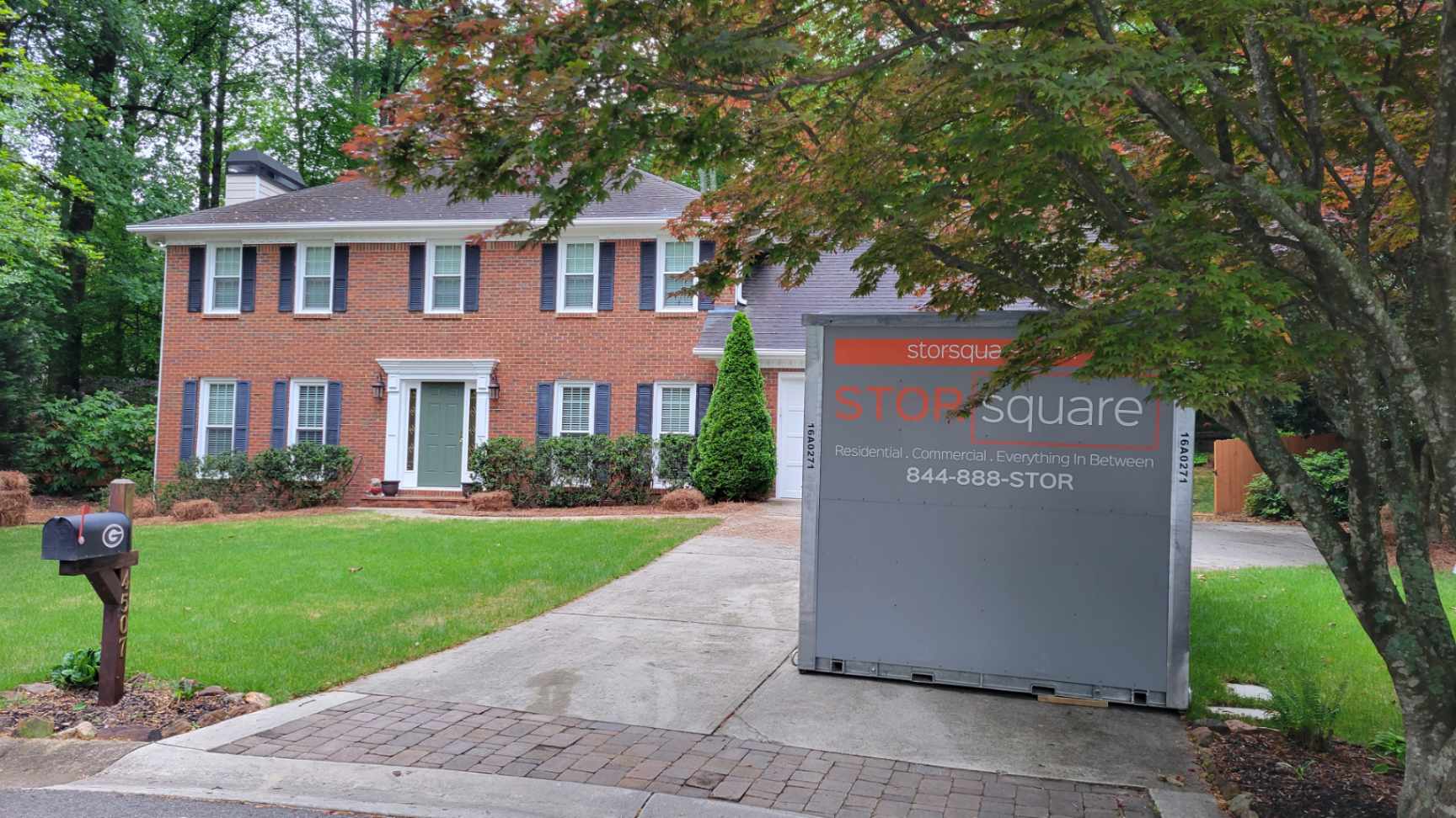 Storage container rentals nearby placed in a residential driveway in Concord, Tennessee during a home decluttering project