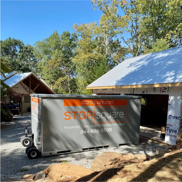 A STORsquare portable storage container used for long distance moving in Central Florida at a residential build site, supporting interstate moves with storage.