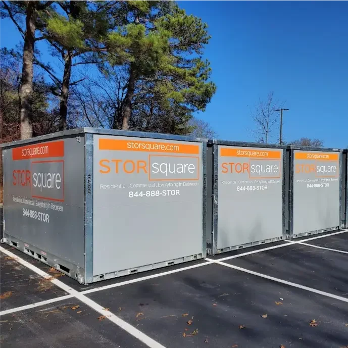 Multiple STORsquare portable storage containers staged in a secure lot in Central Florida for long distance and interstate moving with storage.