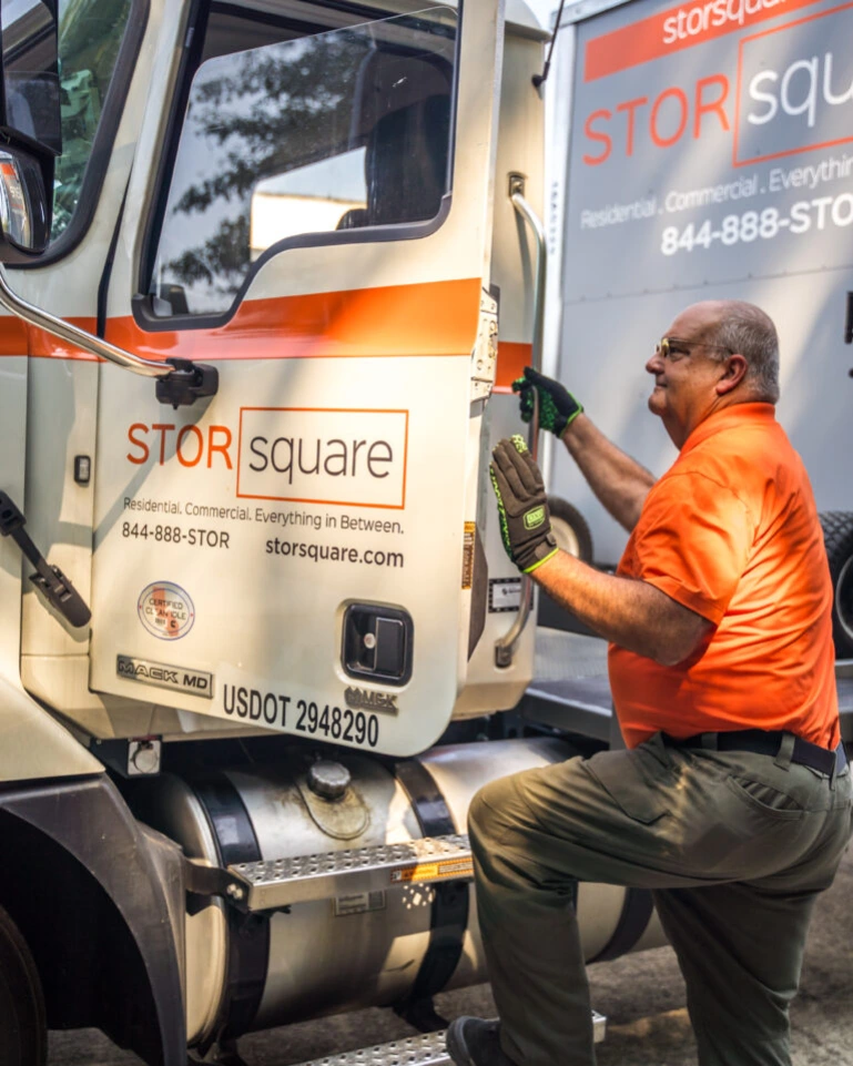 A STORsquare team member preparing a delivery truck, representing portable storage services available across Georgia communities.