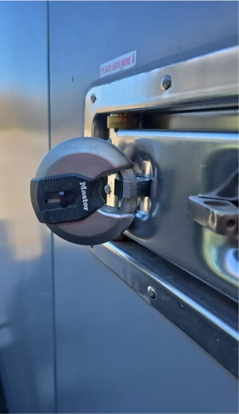Close-up of a secured lock on a STORsquare portable storage container door, showing the locking mechanism used for storage in Tennessee.