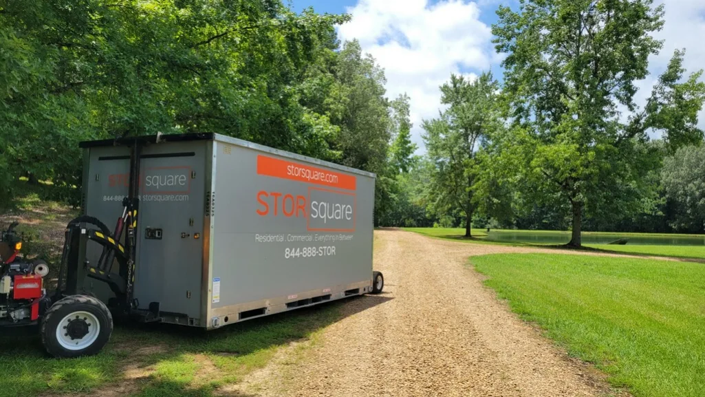 Mobile storage container positioned on a driveway, showing how proper placement helps maximize portable storage units efficiently