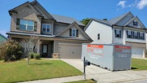 Portable storage container staged in a suburban driveway to help homeowners maximize portable storage units during a local move