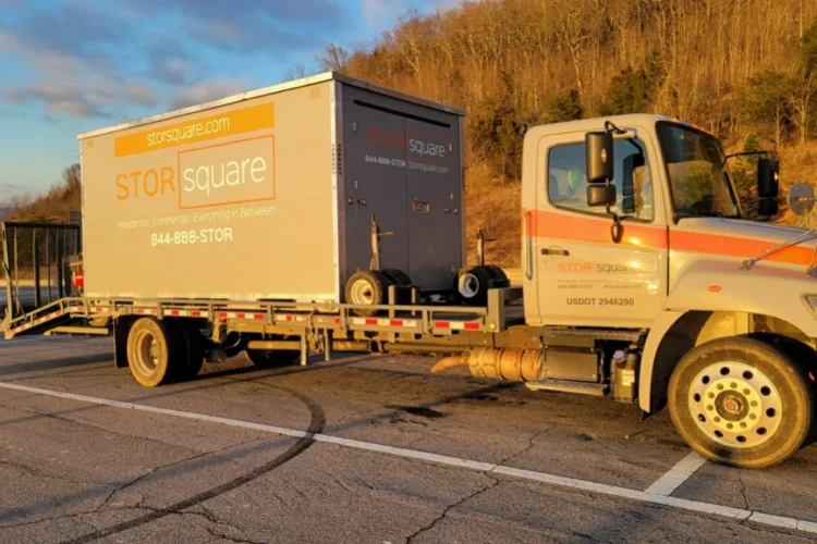 STORsquare mobile storage container being transported for a long-distance move to reduce moving costs.