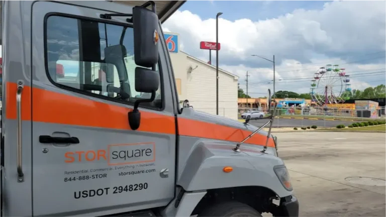 STORsquare portable storage delivery truck parked near a commercial area in Brandon, FL during container transport.