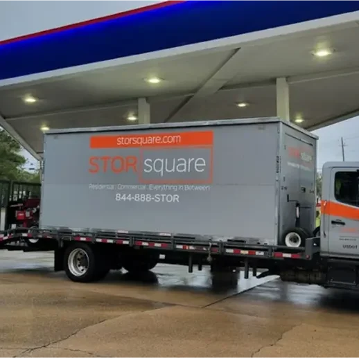 STORsquare mobile storage container transported on a flatbed truck in Charlotte, NC during a local delivery and placement stop