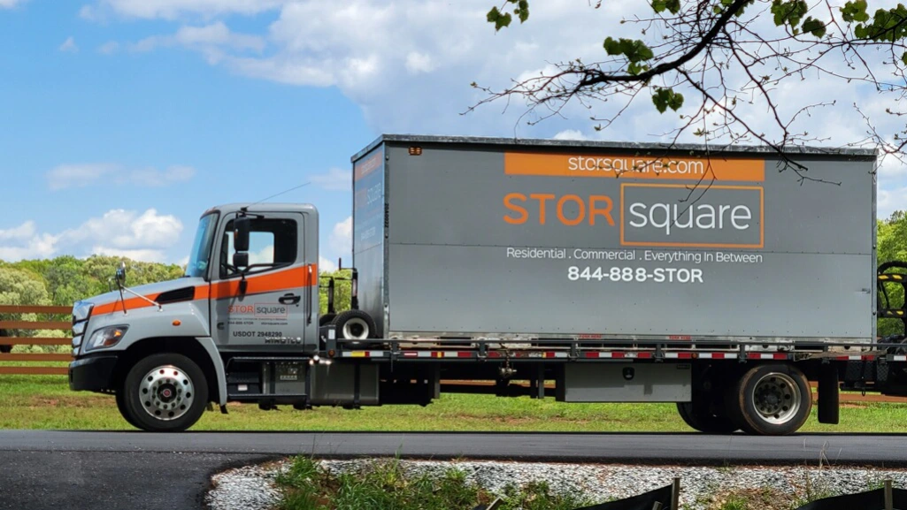 STORsquare mobile storage truck delivering a container for temporary storage for contents during restoration