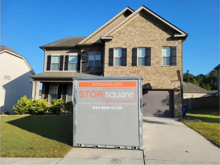 STORsquare moving container positioned in the driveway of a two-story home in Brandon, FL for residential portable storage.