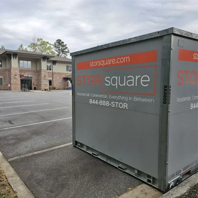STORsquare portable storage container positioned in a commercial parking lot in Brandon, FL outside an office building.