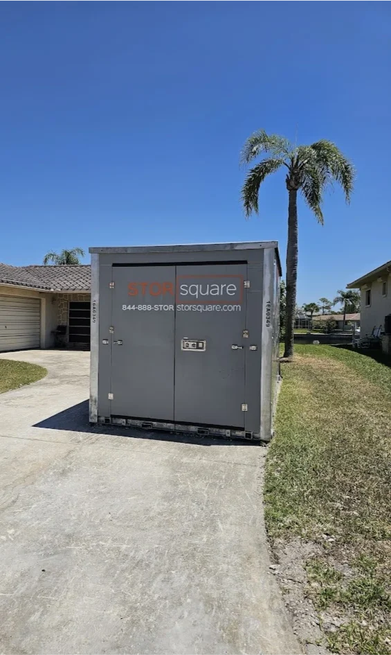 STORsquare portable storage container placed in a Cornelius driveway beside a single-story home.
