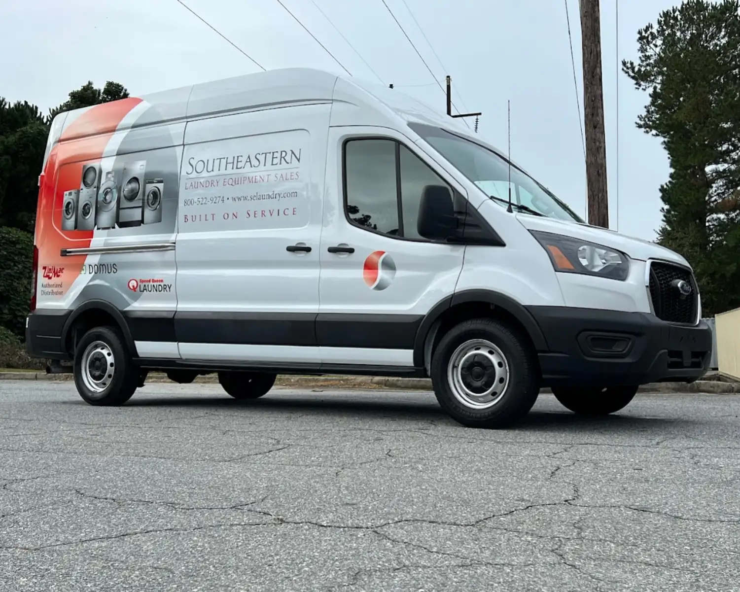 Commercial laundry distributor support service vehicle providing maintenance and support for modern laundromat automation systems