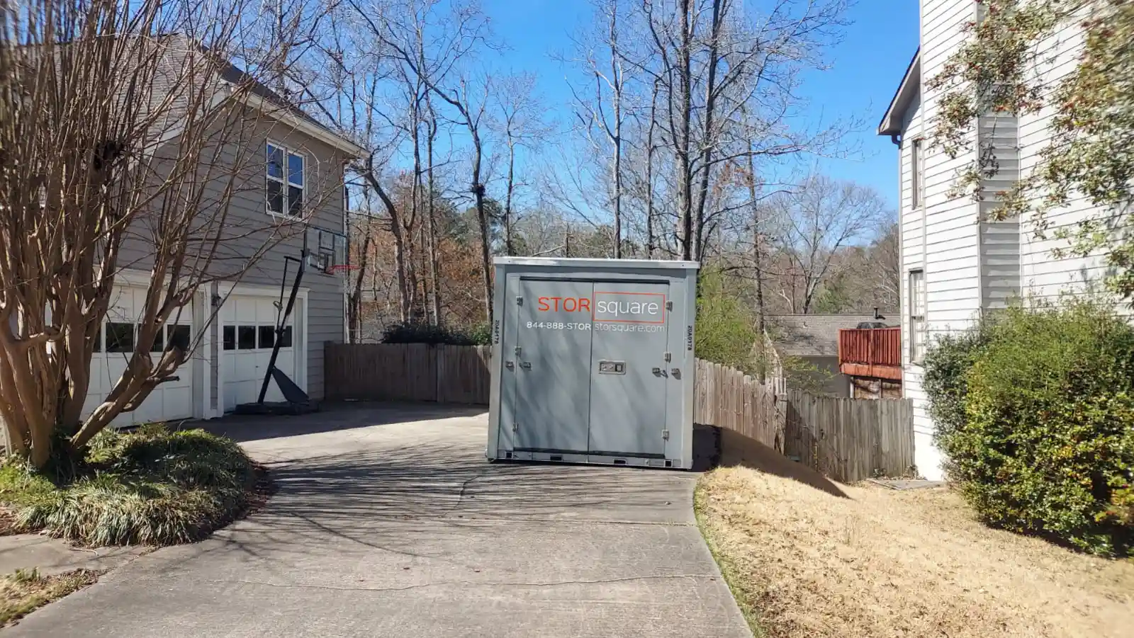 Driveway portable storage container showing storage container rentals help renovations and projects stay organized.