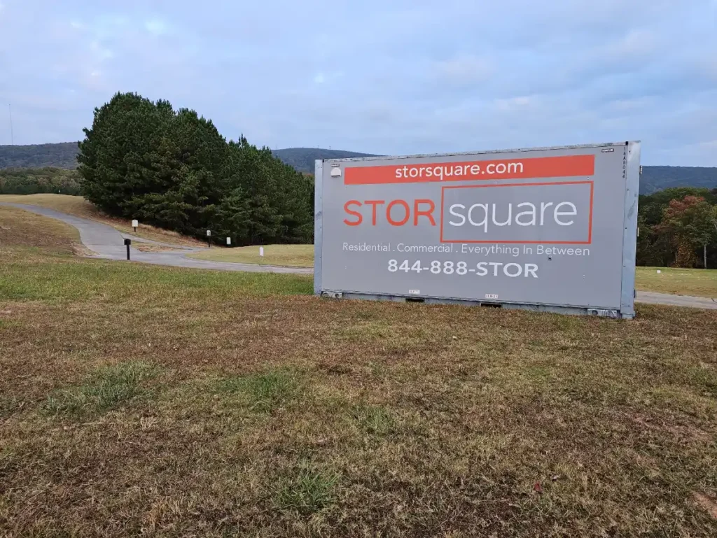 STORsquare portable storage container placed near rural road and wooded landscape