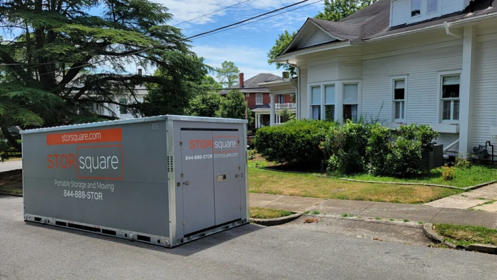 Portable storage container placed outside a home during a local move, helping keep belongings organized throughout the day.