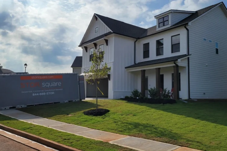 Portable storage container for work relocation outside a suburban home ready for loading