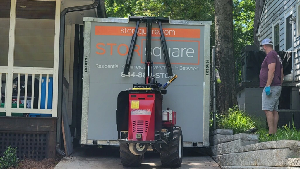 Portable storage during moving with a container being delivered to a residential home