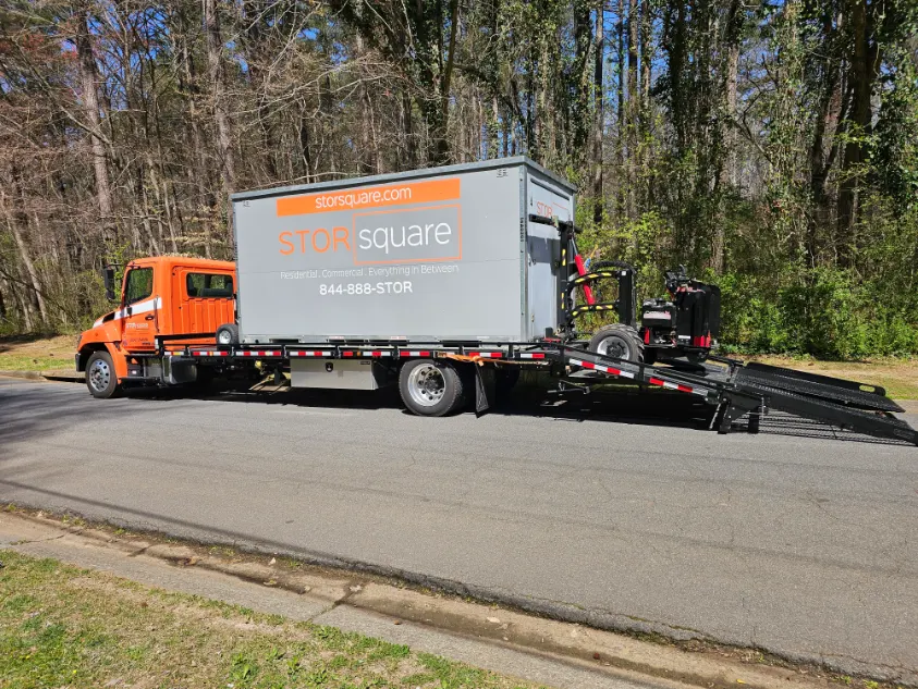 portable storage solutions for restoration being delivered by a STORsquare truck to a job site