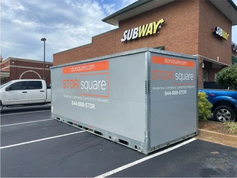 STORsquare portable storage container parked in a commercial parking lot outside a restaurant in Kissimmee, FL.