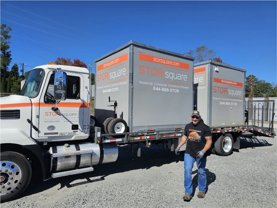 STORsquare driver unloading portable storage containers from a delivery truck in Greensboro, NC.