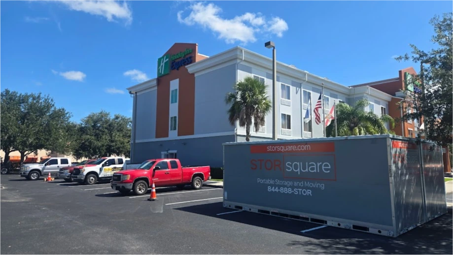 STORsquare portable moving and storage container placed in a hotel parking lot in Kissimmee, FL.
