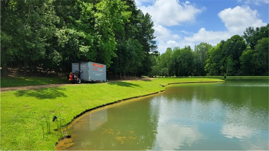 STORsquare storage container delivered on a Gastonia NC property near a pond with surrounding trees.