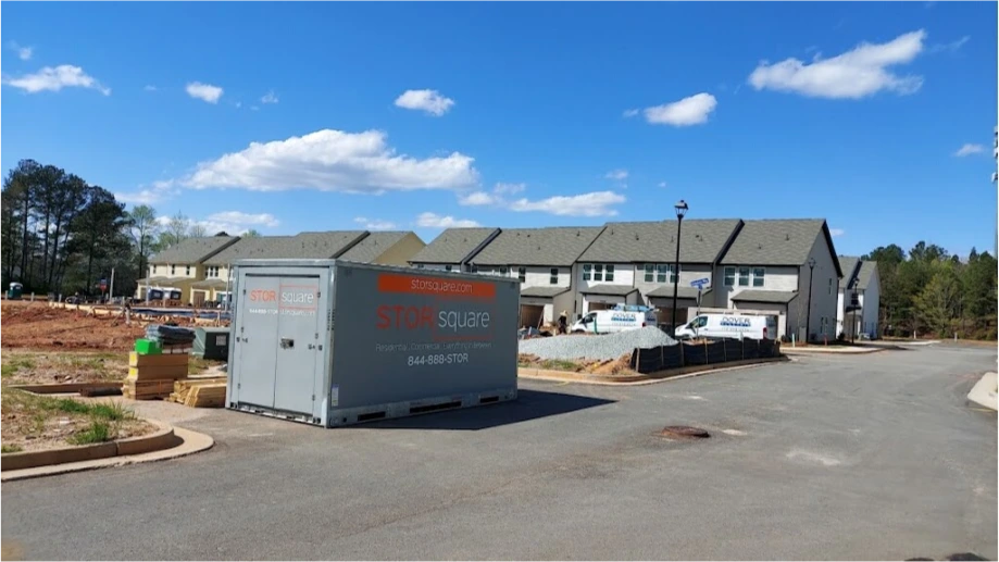 STORsquare storage container placed at a Plant City FL construction site near residential buildings under development.