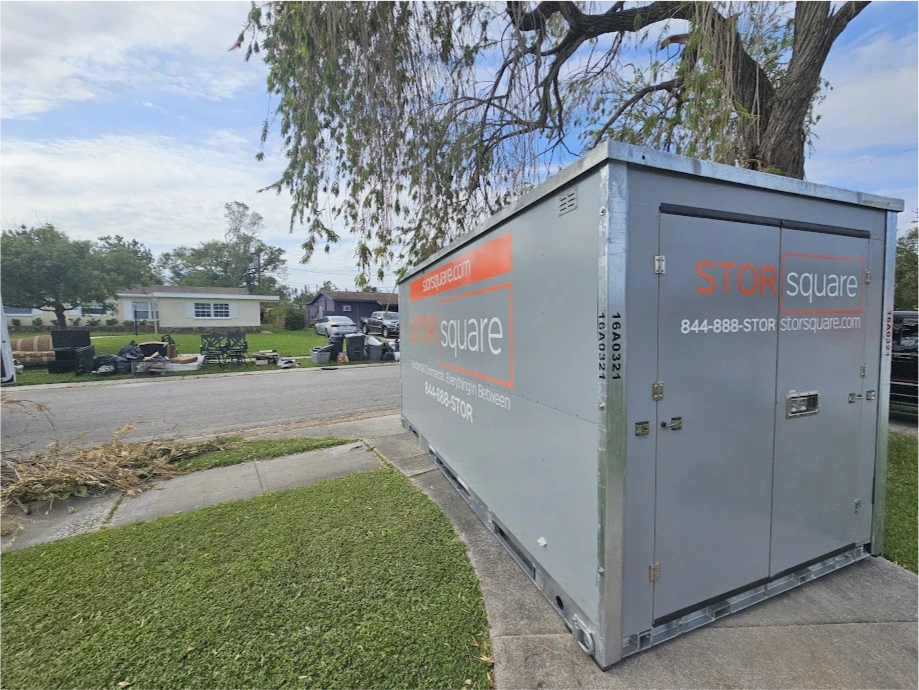 STORsquare storage container placed in a Plant City FL residential driveway within a neighborhood setting.