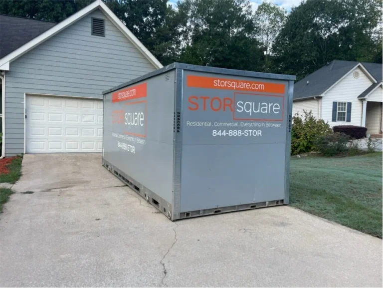 STORsquare storage container positioned in a Woodstock GA driveway in front of a residential garage.