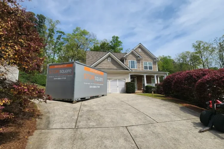 Moving container remodeling plan with a portable storage container placed in a driveway during a kitchen renovation