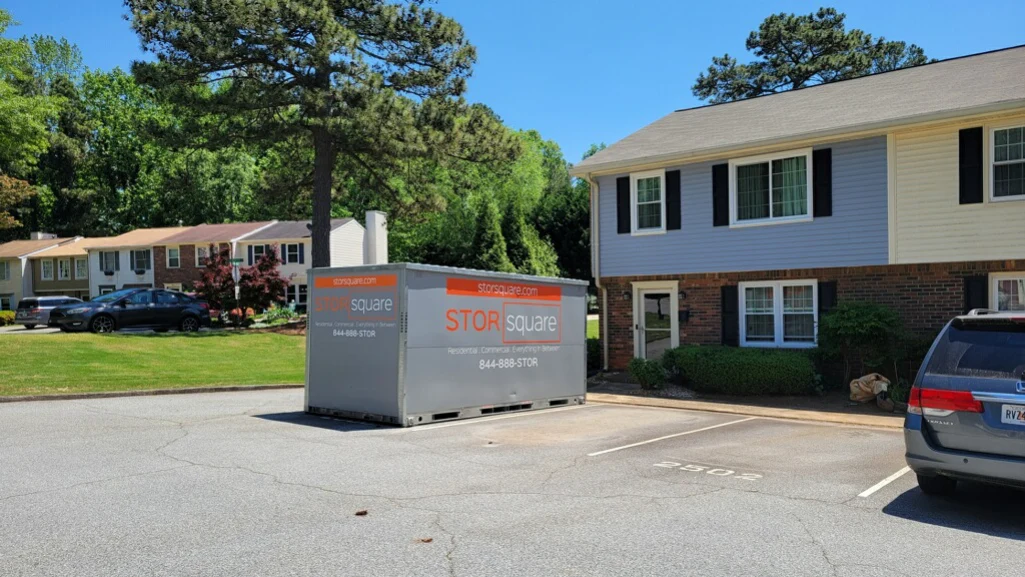 STORsquare portable storage containers placed outside an apartment building for a flexible long-distance move