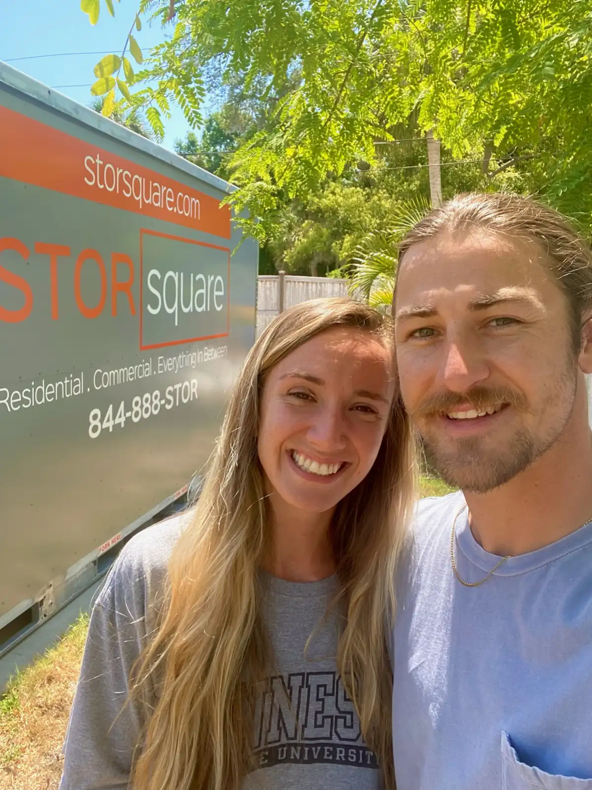 Couple using storage container rentals nearby to create space and organize their home more easily