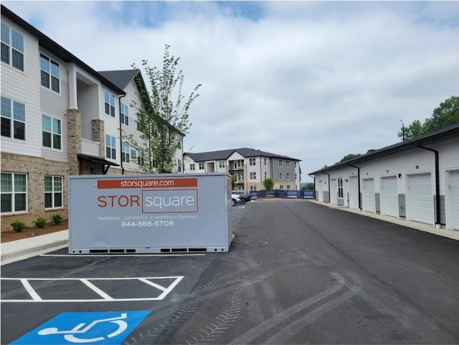 STORsquare mobile storage units placed at a Fort Mill apartment complex near garages and multi-unit residential buildings