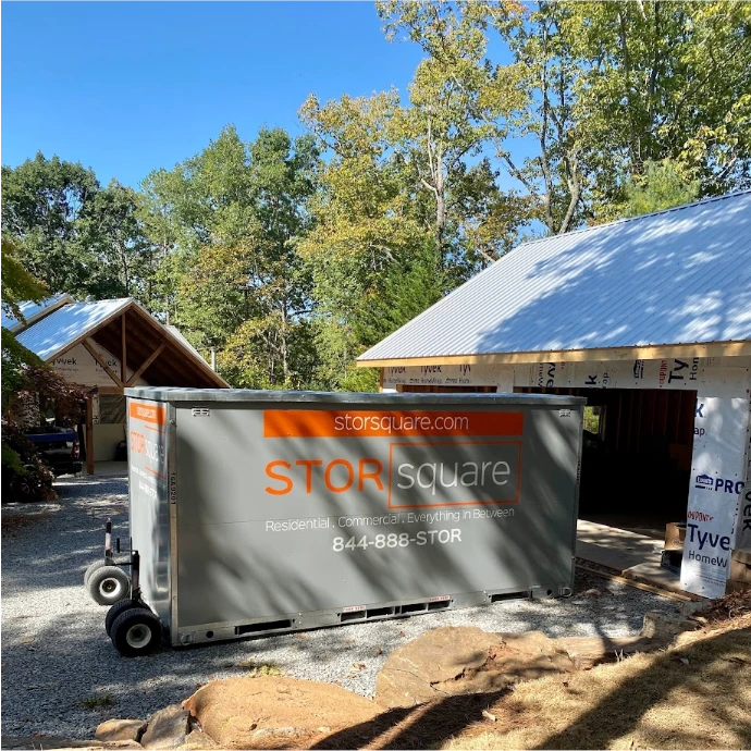 STORsquare mobile storage units placed at a High Point construction site beside a home build and gravel driveway