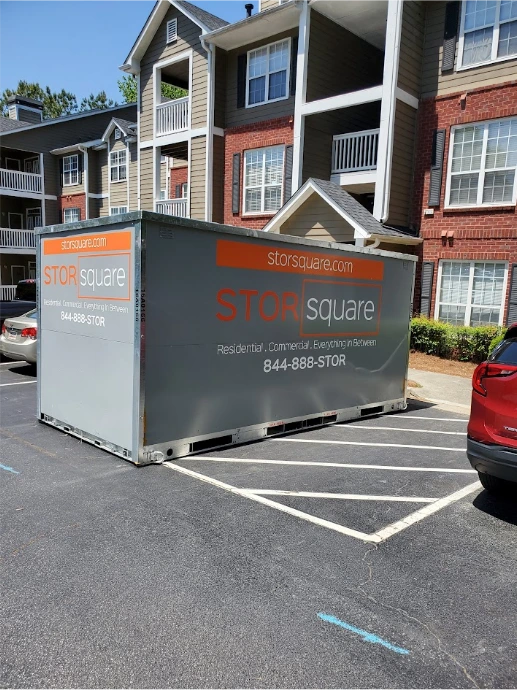 STORsquare portable storage units placed in a Buford apartment parking lot near multi-unit residential buildings