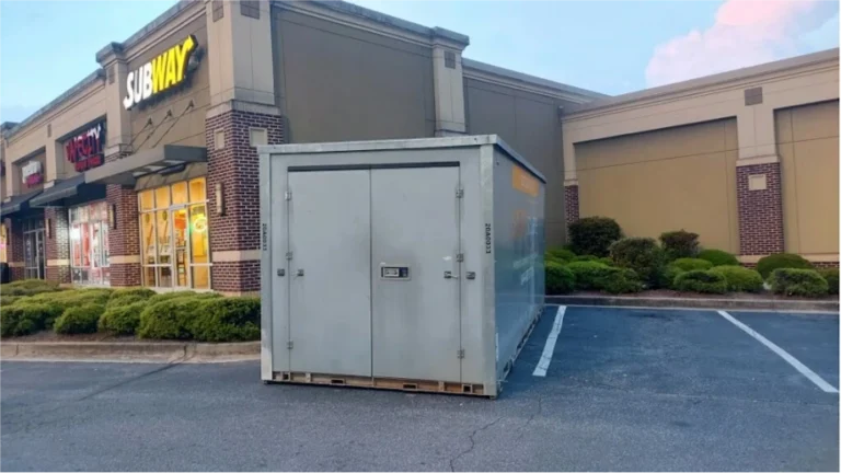 STORsquare storage container placed in a Hickory NC retail parking lot near storefronts and landscaping.
