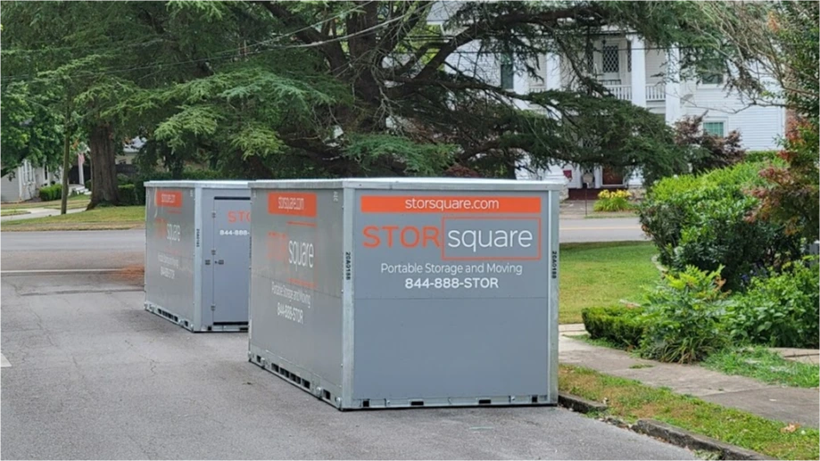 Two STORsquare storage container rentals placed along a Southern Pines residential street near sidewalks and landscaping
