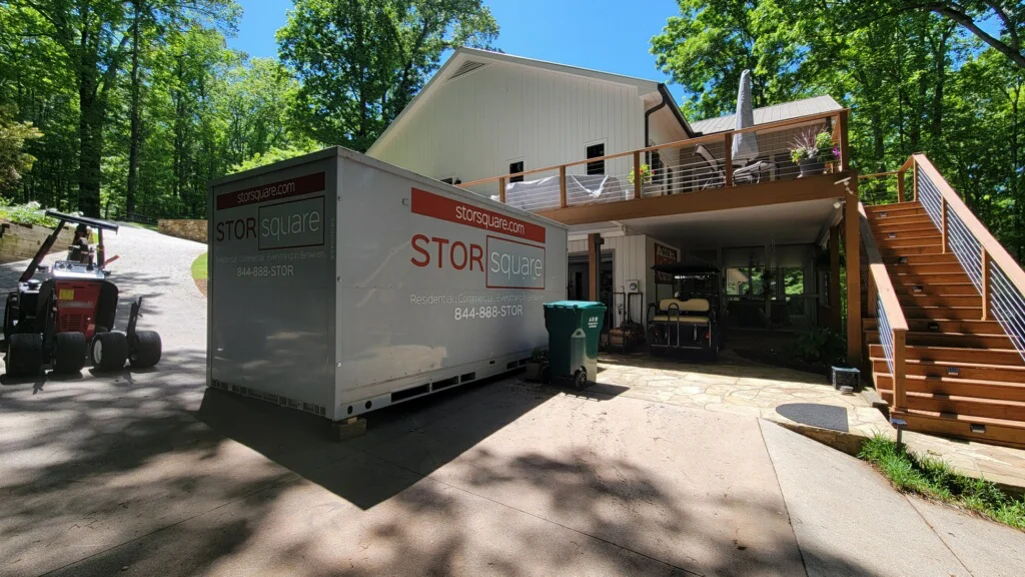 Mobile storage units create space outside a home during a home office reorganization project