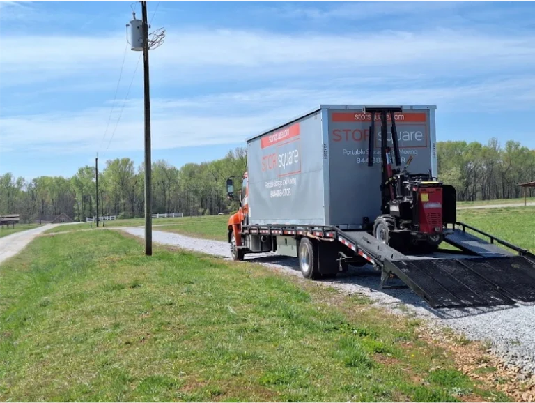 STORsquare portable container delivery truck with the Mule system positioned near a gravel drive in Peachtree Corners.