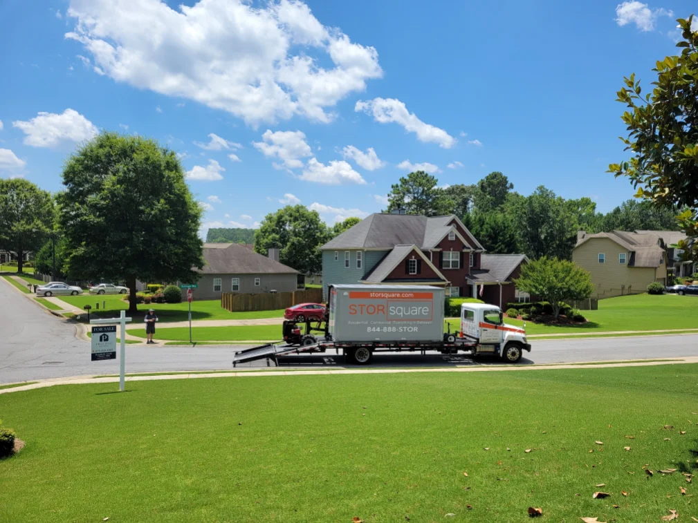 Mobile storage container being delivered to a residential neighborhood for a move in the Maryville area