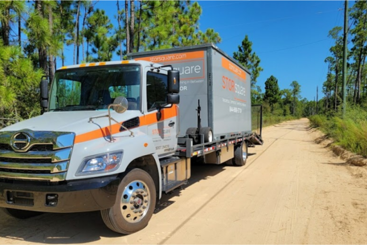 STORsquare truck delivering a portable moving container for residential or business storage in College Park, GA.