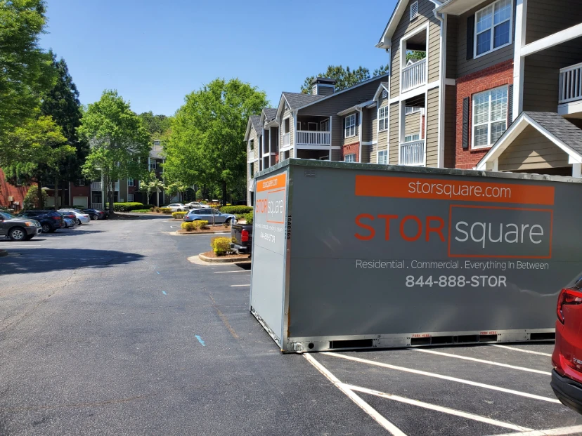 Portable storage containers vs self storage comparison showing a STORsquare container at an apartment community
