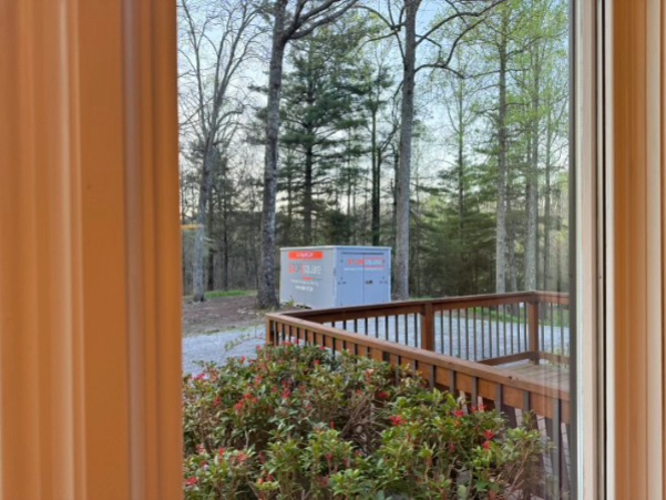 Portable storage units reduce clutter for a Stallings home by keeping extra items outside during organizing